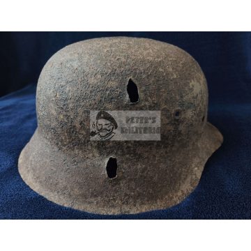 M42 German helmet wiht shrapnel damage