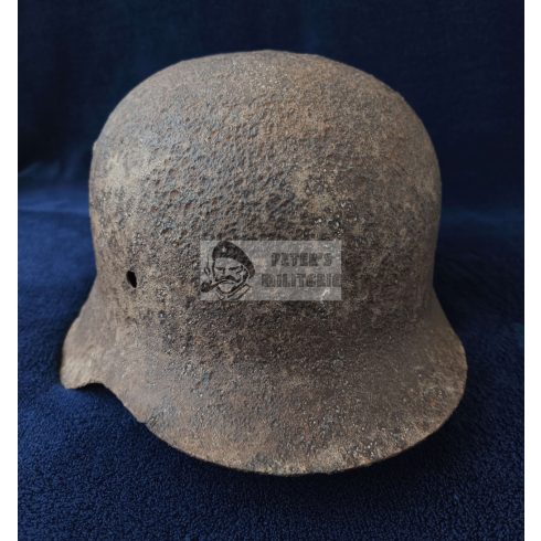M42 German helmet wiht shrapnel damage