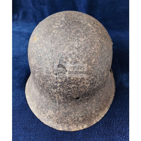 M42 German helmet wiht shrapnel damage