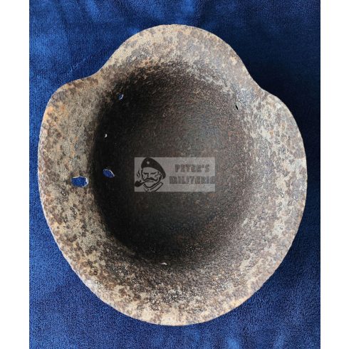 M42 German helmet wiht shrapnel damage
