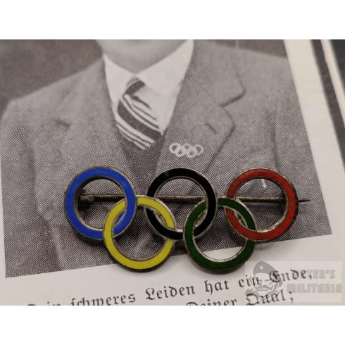 Olimpiai ötkarika kitűző viselést bemutató halálozási értesítővel 